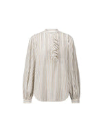 Blouse blanche ample en coton pour femme à rayures tissées avec col rond, manches bouffantes, plis plats et volants asymétriques sur le devant, modèle Fa de la marque Laurence Bras.