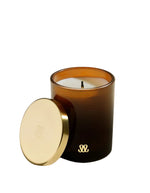 Bougie Stella Bois de Santal 200Gr dans un verre teinté fauve avec couvercle doré et monogramme.