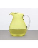 Carafe Memento Synth en plexi jaune citron avec poignée transparente et bulles d'air.