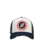 Casquette trucker Sweet Pants bicolore bleu marine et blanc avec patch logo feutrine et visière léopard destroy.