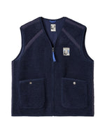 Gilet sans manches pour homme en sherpa bleu marine avec bandes en nylon, poches à pression et logo Jonsen embossé au dos, modèle Bianca de la marque Jonsen Island