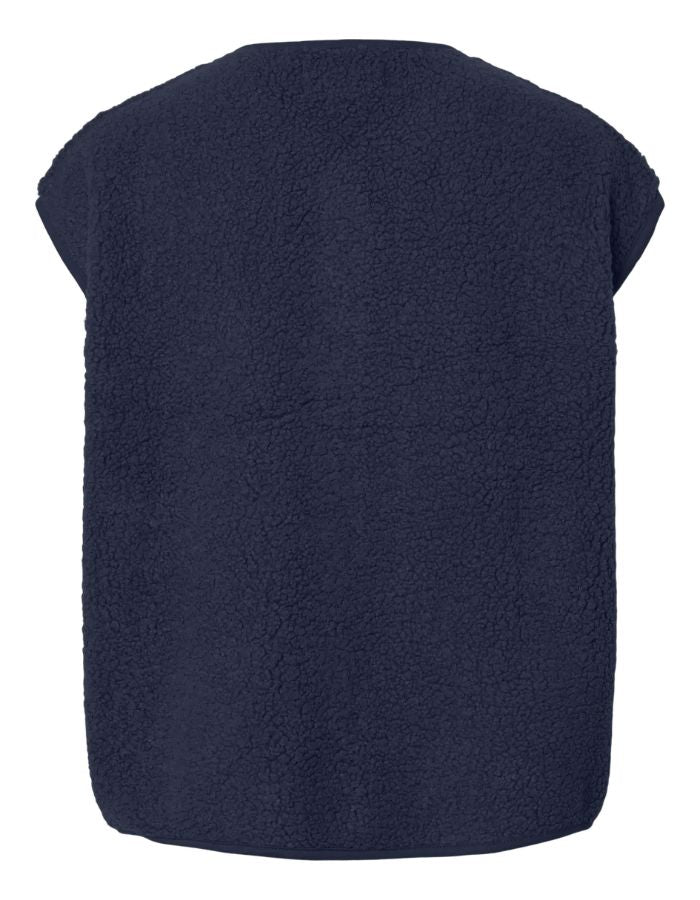 Dos du Gilet sans manches pour femme Katty Teddy, coloris bleu marine (Navy). Matière bouclée douce type polaire, col en V et poches latérales. Fermeture par boutons-pression. Veste écoresponsable en polyester recyclé.