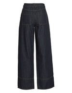 Jean Brixton en denim bleu foncé, coupe droite, taille mi-haute, avec surpiqûres discrètes.