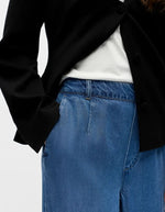 Pantalon large fluide denim Frame bleu, taille mi-haute élastiquée, poches latérales.
