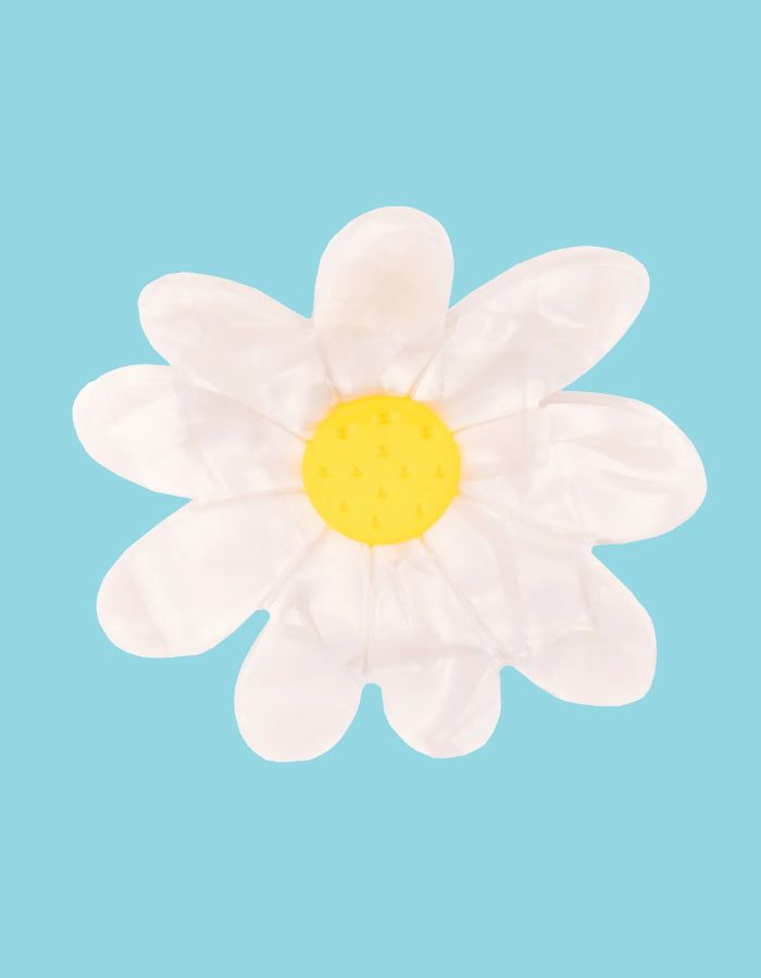 Pince à cheveux Pâquerette blanche et jaune en acétate de cellulose, style floral délicat.