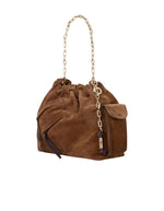 Profil du Sac cabas pour femme en suède marron avec poches extérieures zippées, pochette latérale, anse en chaîne et lien tressé, modèle June de la marque BA&SH