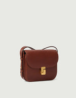 Sac Bellissima Mini cognac en cuir caviar avec fermoir monogramme doré et bandoulière ajustable.