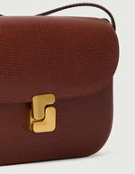 Sac Bellissima Mini cognac en cuir caviar texturé avec fermoir monogramme doré.