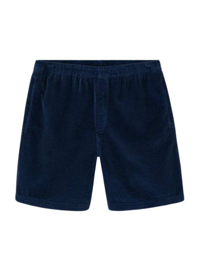 Short mi-long pour homme en velours côtelé bleu marine foncé Navy Vintage, modèle Padow de la marque American Vintage. Présente une coupe ample et droite avec une taille élastiquée et des poches discrètes intégrées sur les côtés.