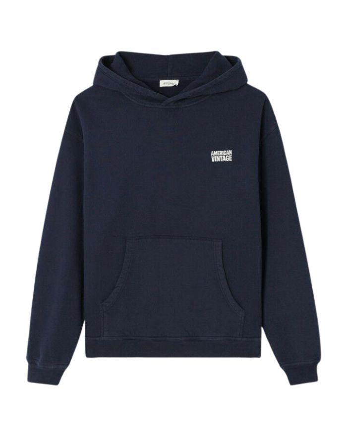 Sweat à capuche oversize bleu marine délavé pour homme en molleton coton doux avec poche kangourou et finition peau de pêche, modèle Plizzy couleur Navy Vintage de la marque American Vintage