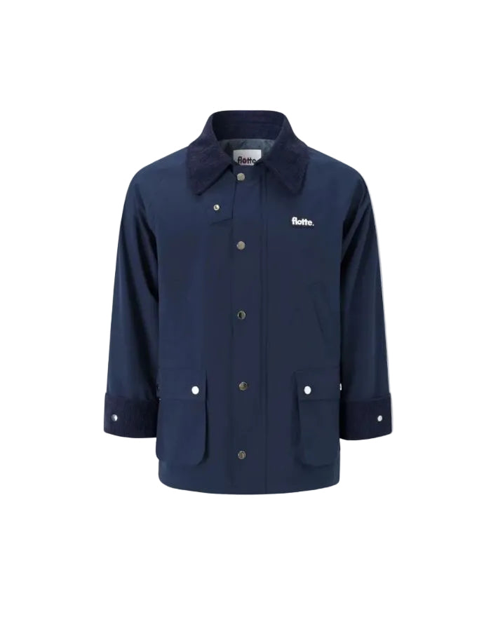 Veste mi-longue imperméable et coupe-vent indigo pour homme et femme avec col contrasté, capuche amovible et 4 poches, modèle Veste Archives couleur Indigo de la marque Flotte.