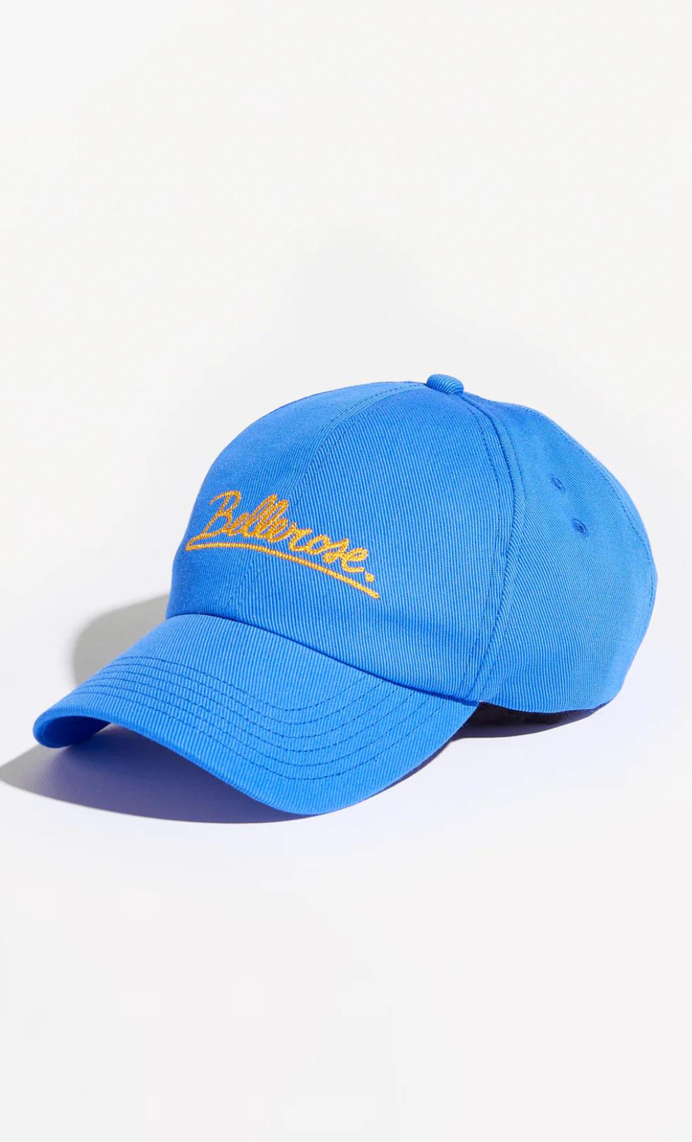 Casquette Bace Bellerose bleue en coton mélangé, design 6 pans, logo Bellerose brodé orange.