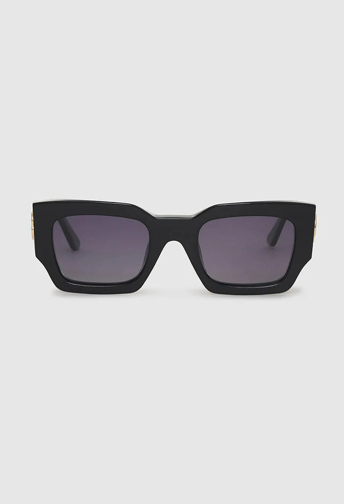Solaires Indio Monogram Black Anine Bing: monture carrée oversized en acétate noir, monogramme AB doré.