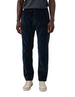 Pantalon droit pour homme en velours côtelé seersucker bleu marine 100% coton avec ceinture élastiquée à cordon de serrage, modèle Joggy de la marque Hartford.