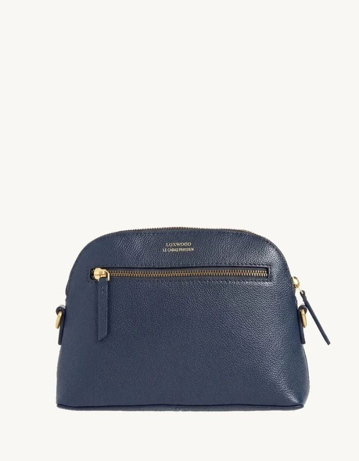 Dos du Petit sac bandoulière demi-lune pour femme en cuir grainé bleu nuit avec fermeture zippée, modèle Demi-Lune de la marque Loxwood.