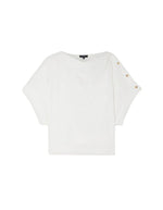 Blouse Issa blanc cassé en coton biologique, coupe ample, col tombant et boutons dorés à l'épaule.