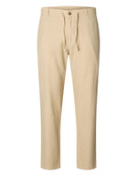 Pantalon Brody Slim Tapered beige en lin et coton avec cordon de serrage et bouton.