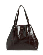 Grand sac cabas souple pour femme en cuir de vachette vernis bordeaux, modèle Odéon de la marque LOXWOOD. Présente deux anses de porté épaule, une patte de fermeture magnétique et un pompon amovible en cuir.