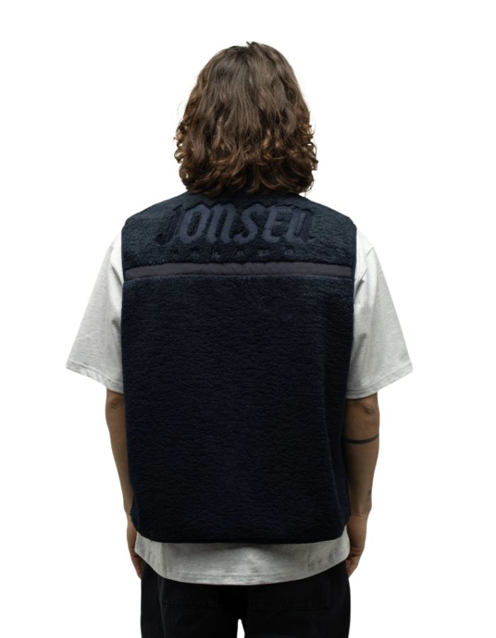 Dos du Gilet sans manches pour homme en sherpa bleu marine avec bandes en nylon, poches à pression et logo Jonsen embossé au dos, modèle Bianca de la marque Jonsen Island