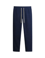 Pantalon de jogging ajusté coupe droite pour homme et femme en molleton bleu nuit 350g avec cordon beige et patch logo dos, modèle Iconic Straight couleur Night de Sweet Pants.
