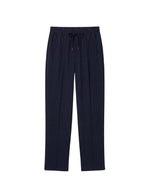 Pantalon large pour femme en flanelle bleu nuit, modèle Oliver de la marque Hana San. Présente une taille élastiquée avec cordon à nouer, des poches latérales et des nervures structurantes sur le devant.