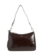 Sac porté épaule pour femme en cuir de vachette vernis bordeaux, modèle Sam de la marque LOXWOOD. Présente une forme compacte zippée sur le dessus et une anse réglable.