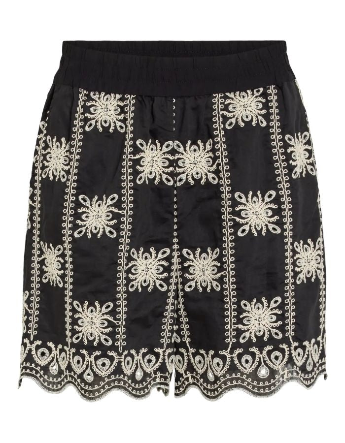 Short taille haute fluide Nala par Rouge Edit, coloris noir Meteorite Embroidery. Coupe large avec poches latérales et broderies ton sur ton élégantes. Tissu soyeux en mélange de lyocell.