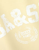 Sweat Beata Jaune Ba&sh en coton biologique, sans manches, avec logo blanc vieilli et motif "2003 Paris".