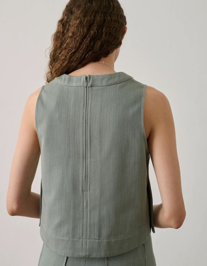 Dos du top Pampa Vert d'Eau en toile de coton, coupe droite, zip invisible et fentes latérales.